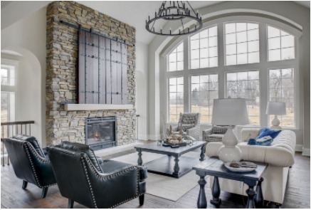 Living room fireplace with massive stone mantel