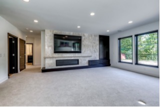 Wide fireplace in brightly lit room