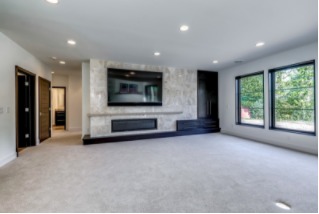 Wide fireplace in brightly lit room