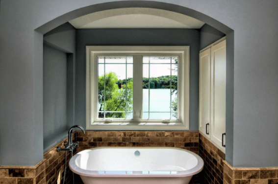 A custom-built master bathroom featuring a free-standing tub